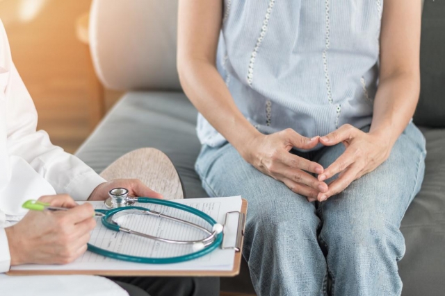 close up of woman s hands and doctor talking